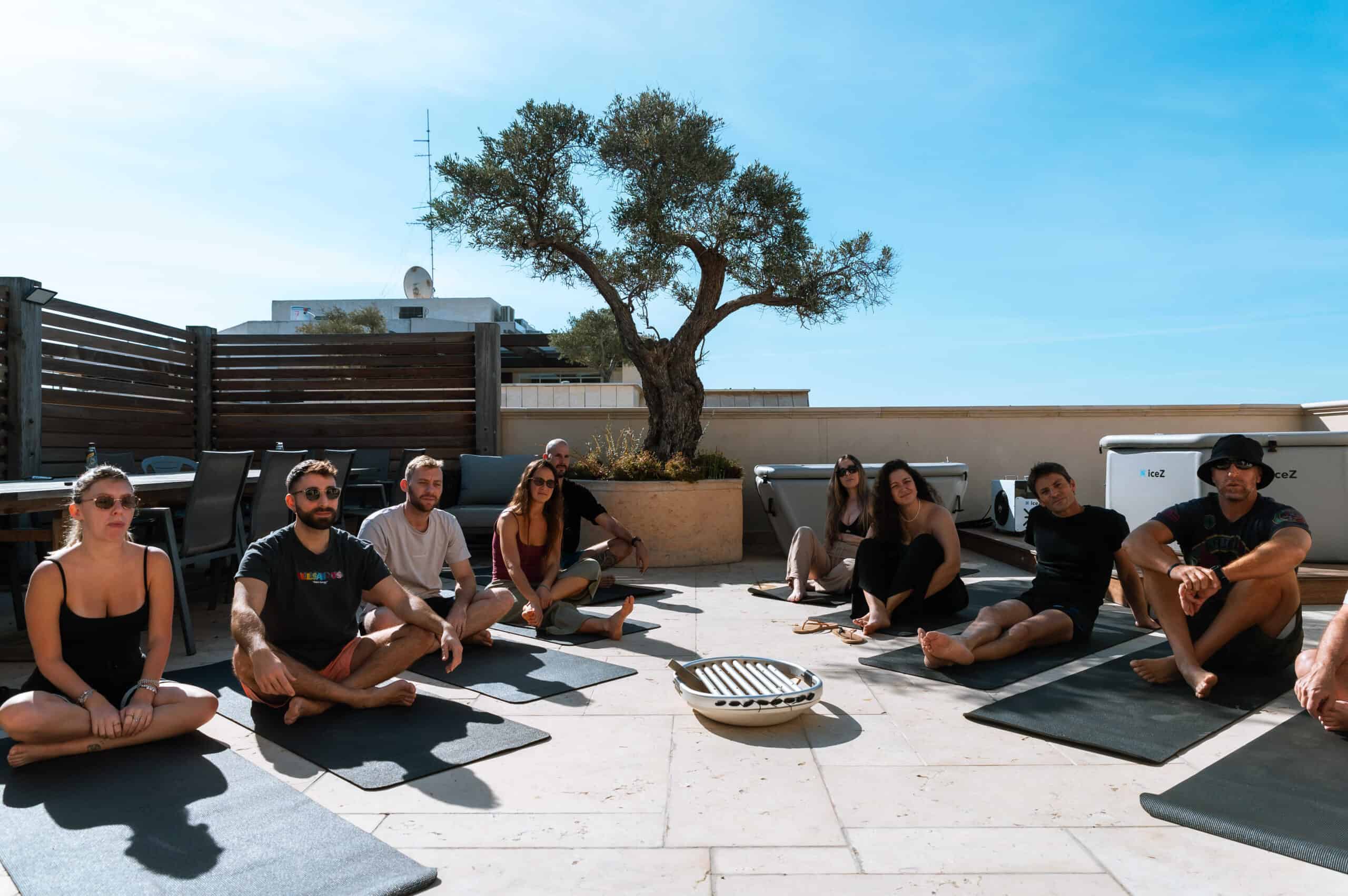 Group session on mats on a rooftop